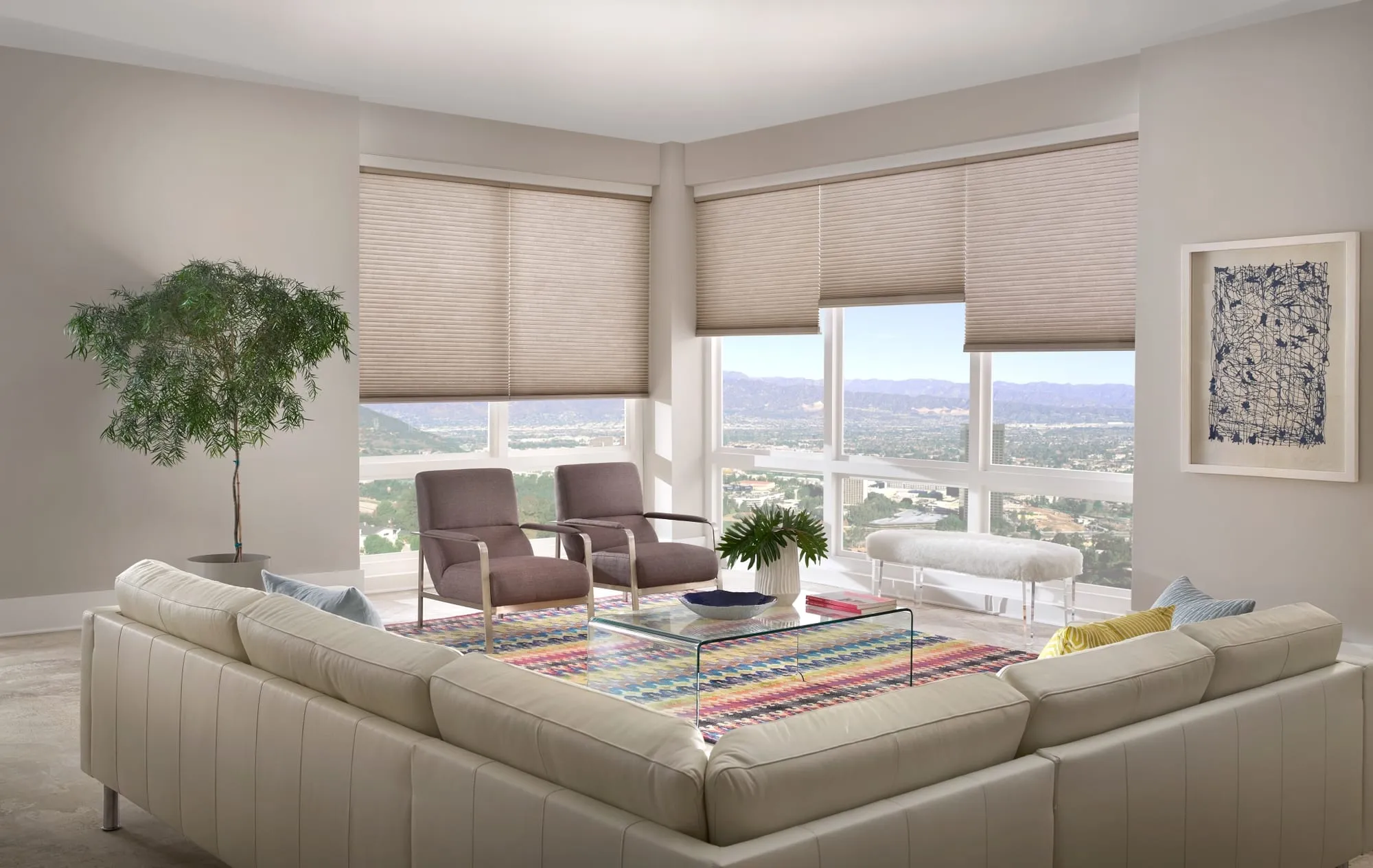 Alta cellular shades on a corner of windows in a bright living room