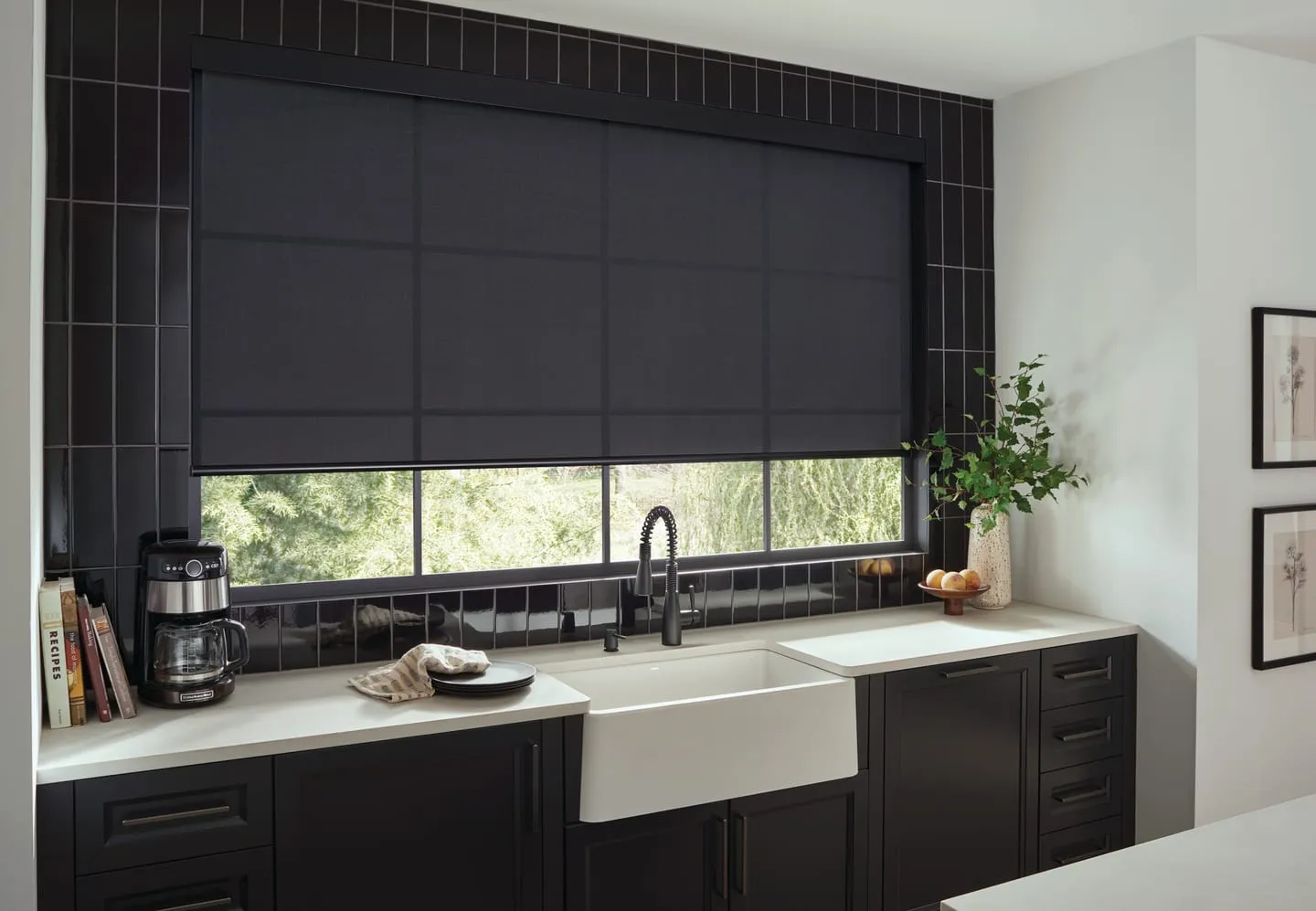 The same kitchen window with a dark Alta roller shade