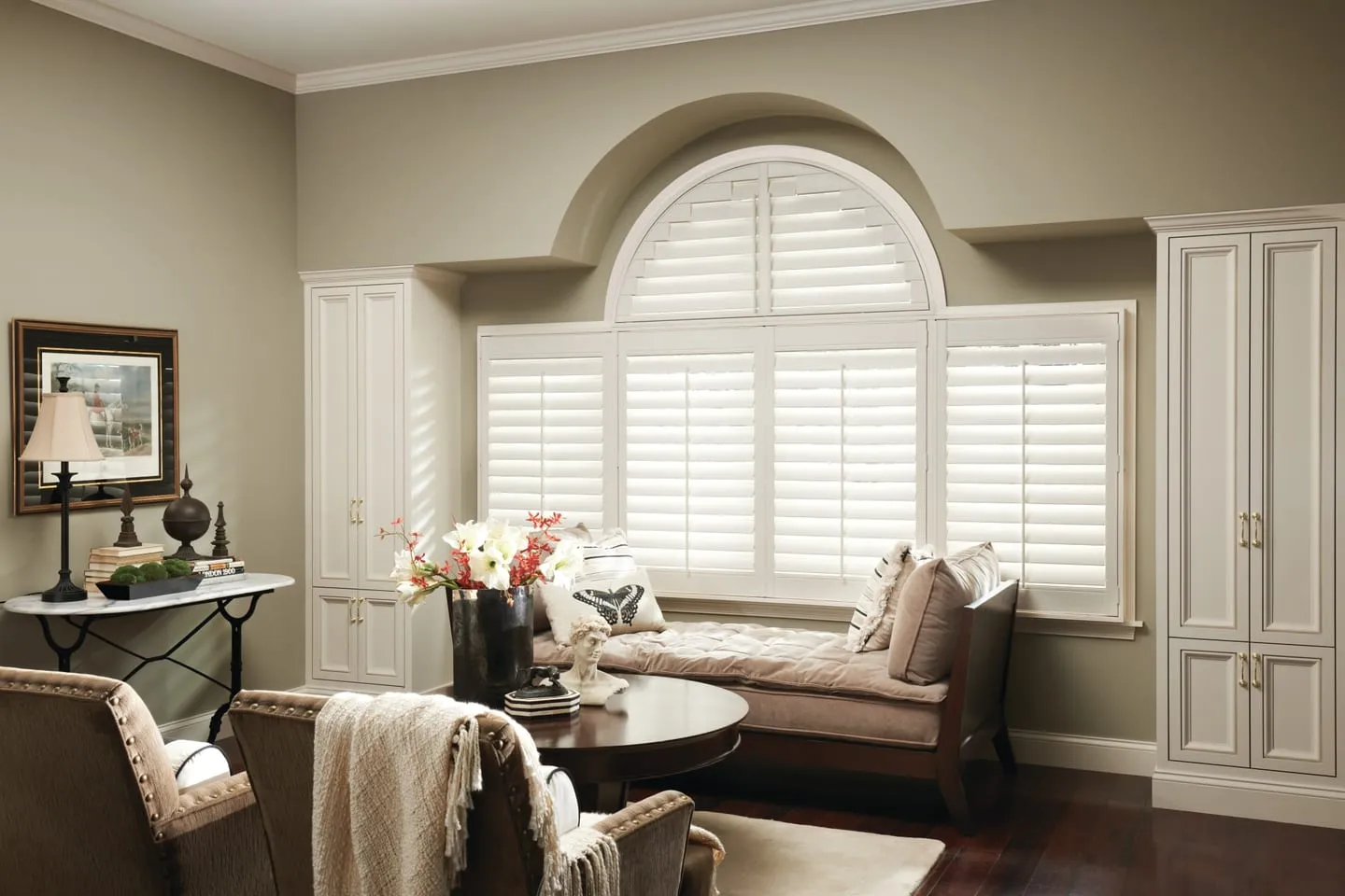 The same arched window fitted with white Alta shutters