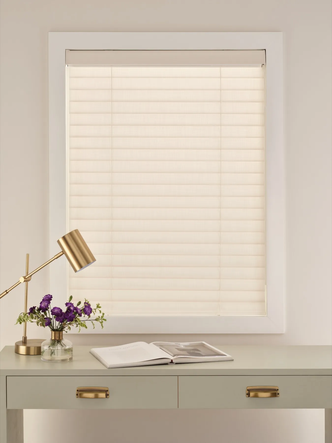 Aria™ Soft Blinds with the fabric vanes closed, glowing softly