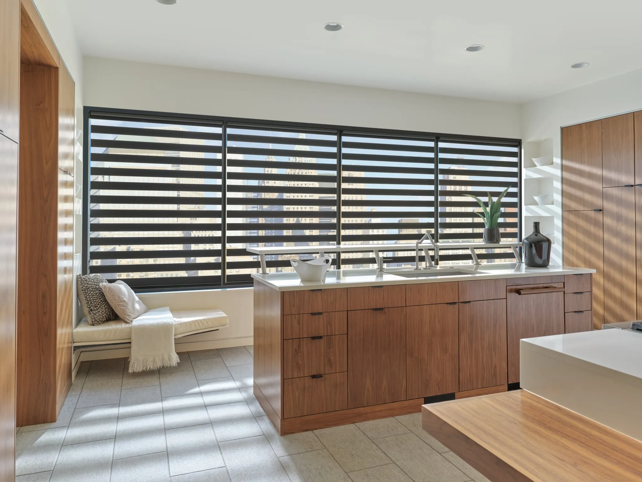 Designer banded shades across a wide kitchen window
