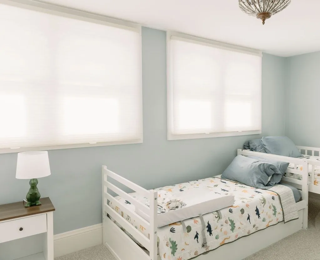 The same bedroom after Duette® honeycomb shades were installed