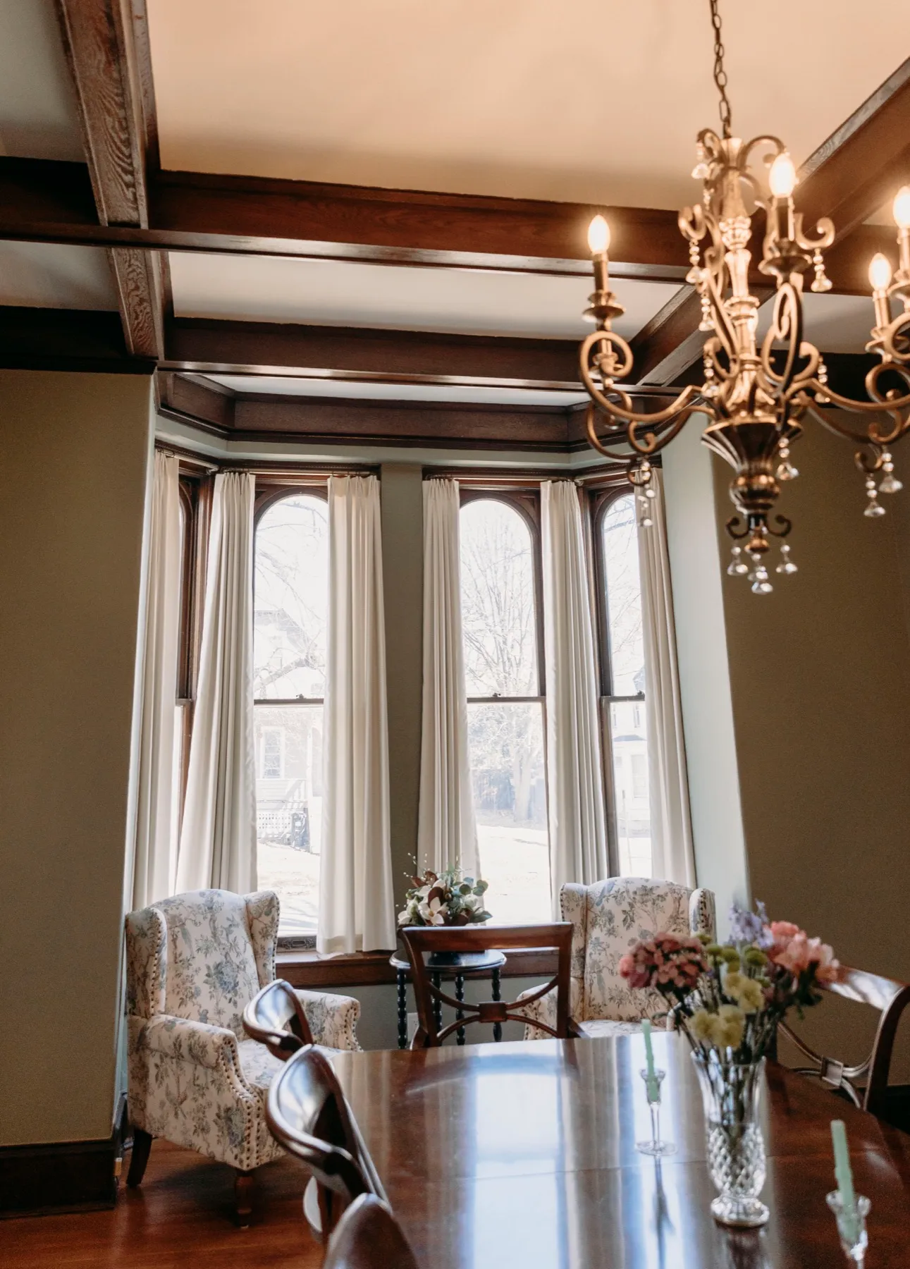 Dining room bay window with full-length draperies