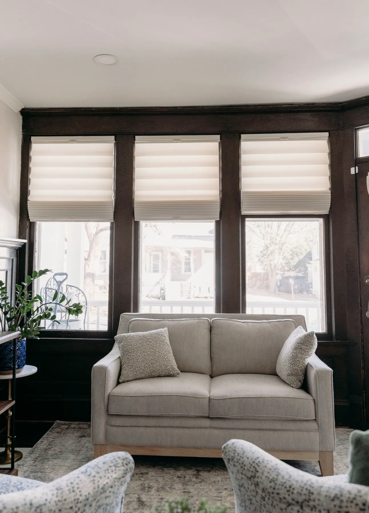 Sitting room with flat roman shades on three windows