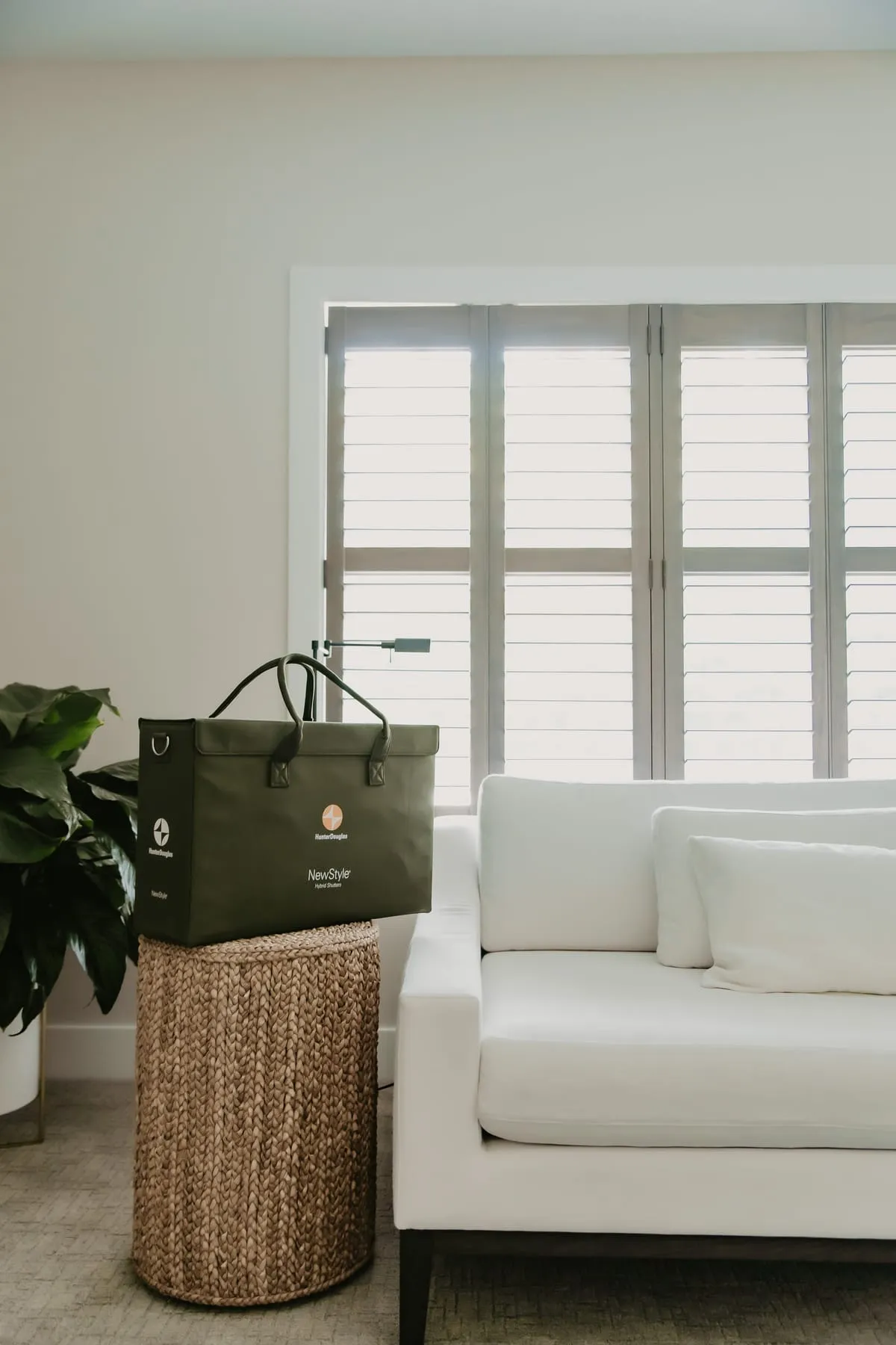 Living room with white shutters and a white sofa