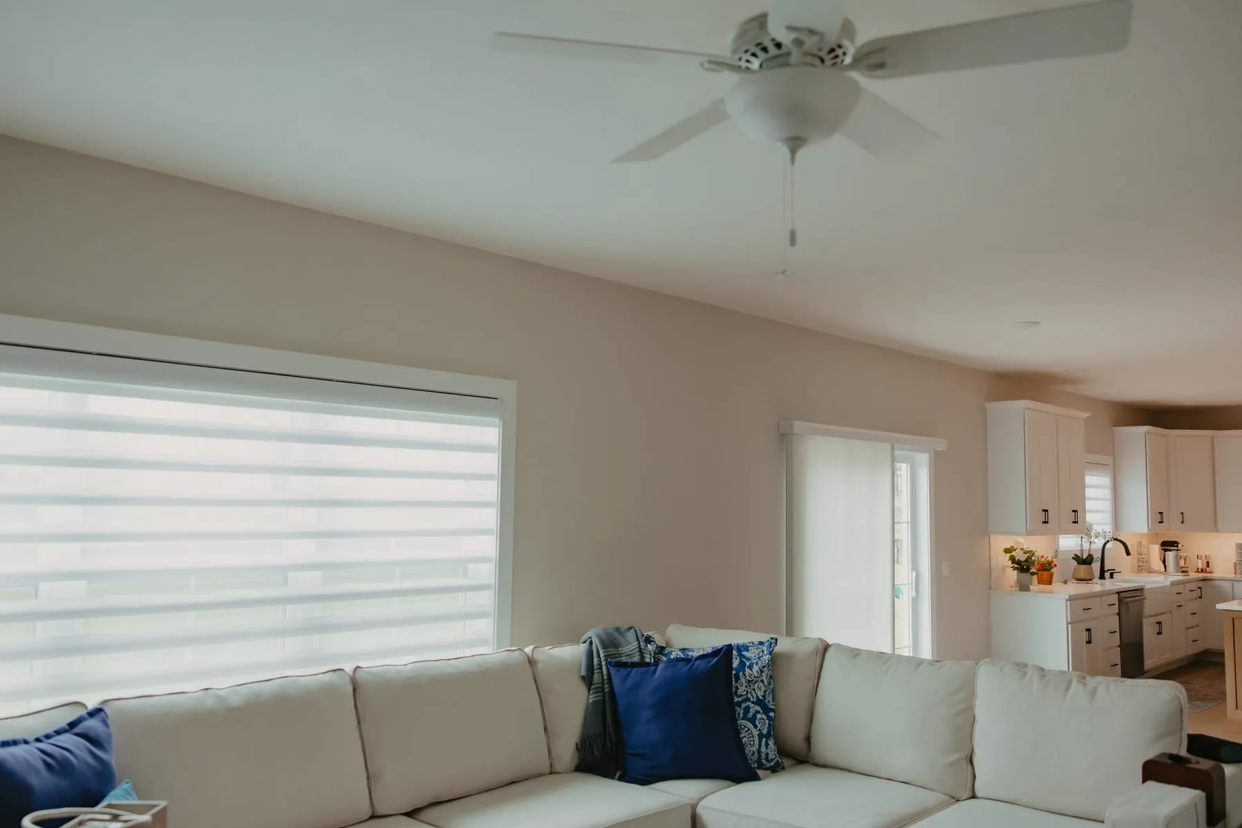 Living room and kitchen with sheer shades