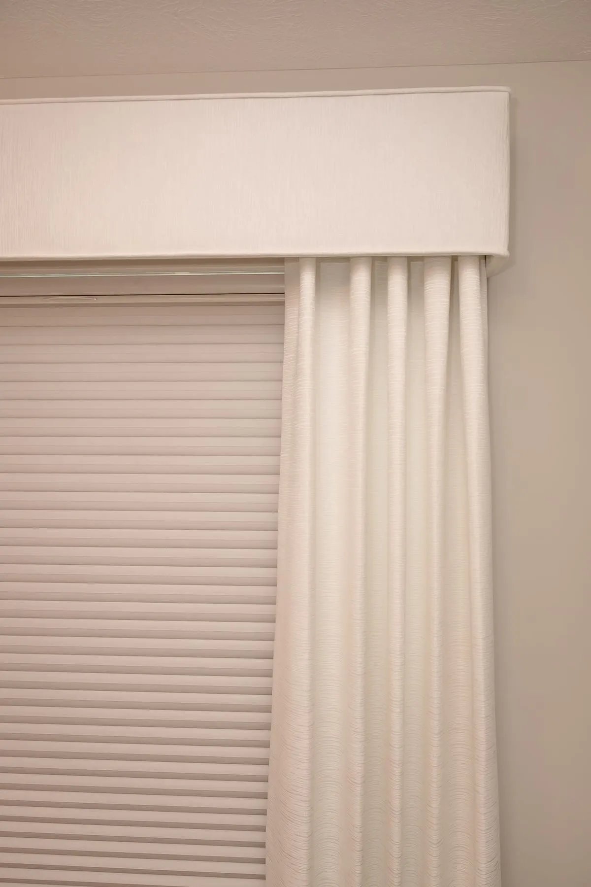 Drapery panel and valance over a window shade