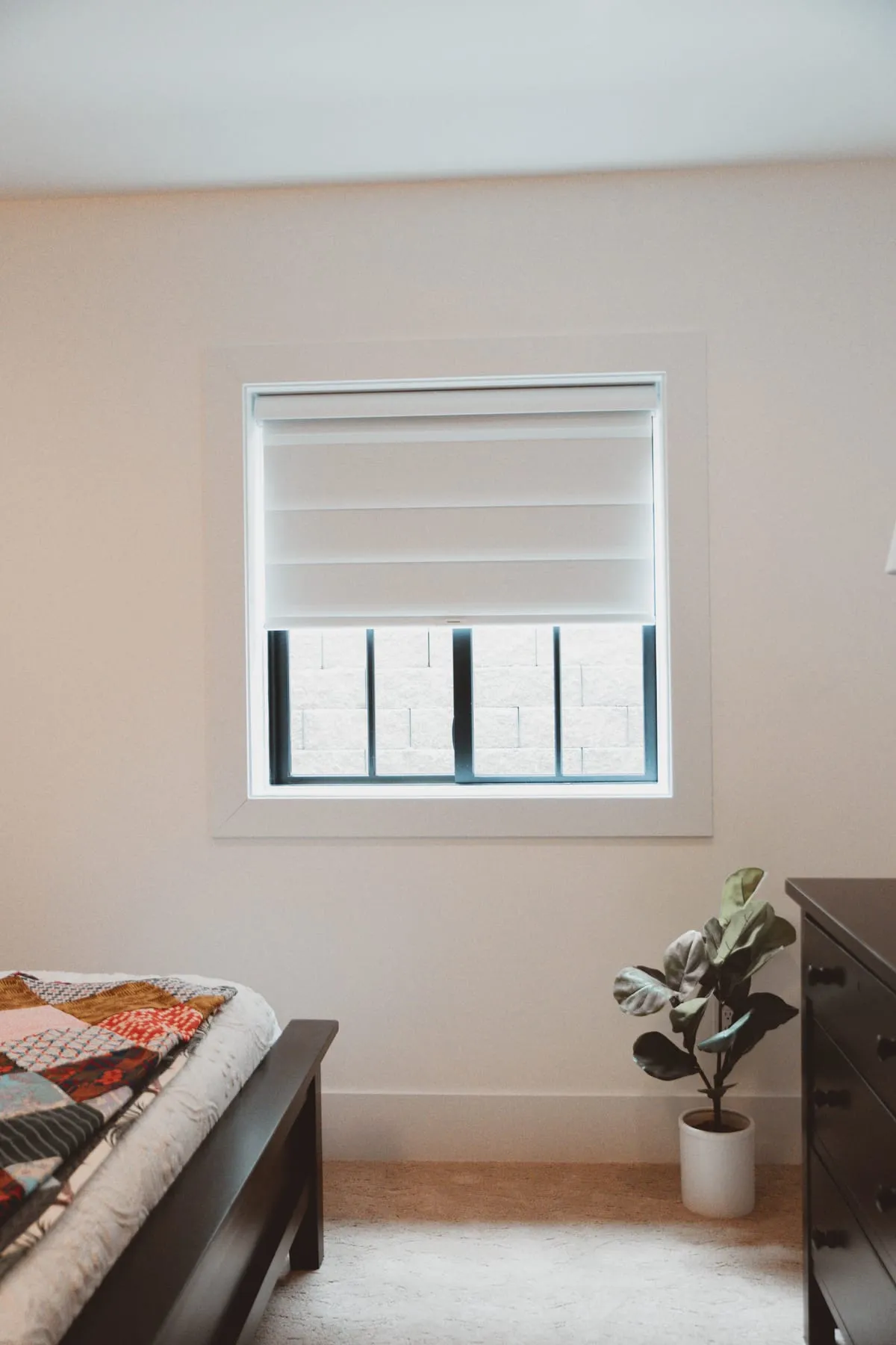 Bedroom window with a soft fabric shade