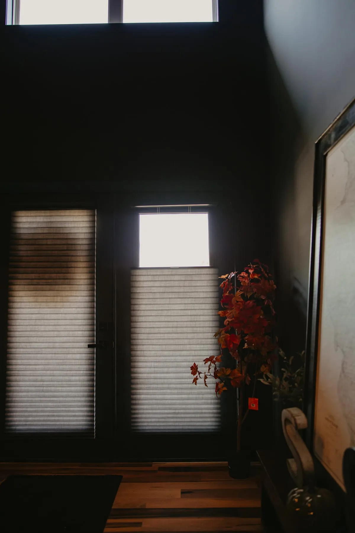Patio door with shades in a dark modern room