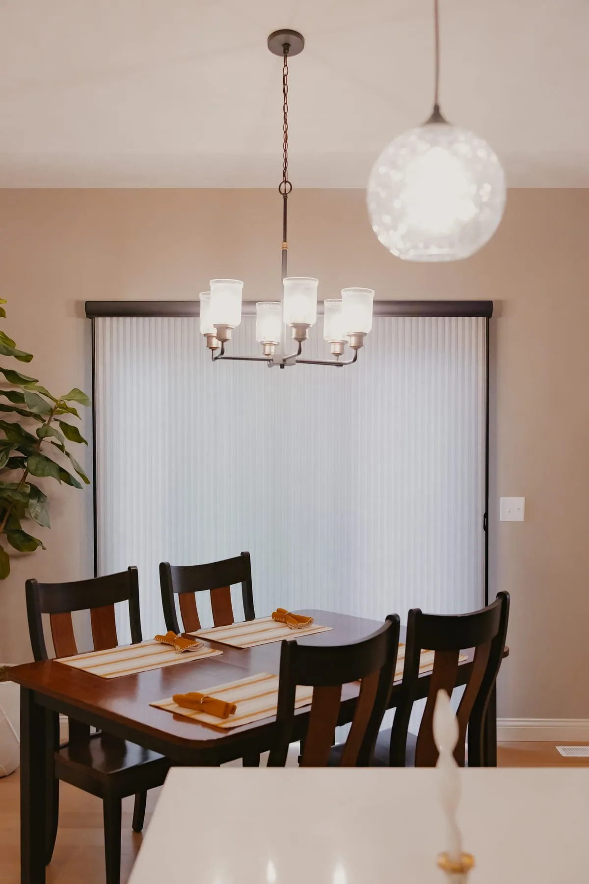 Dining room with a shade on the patio door