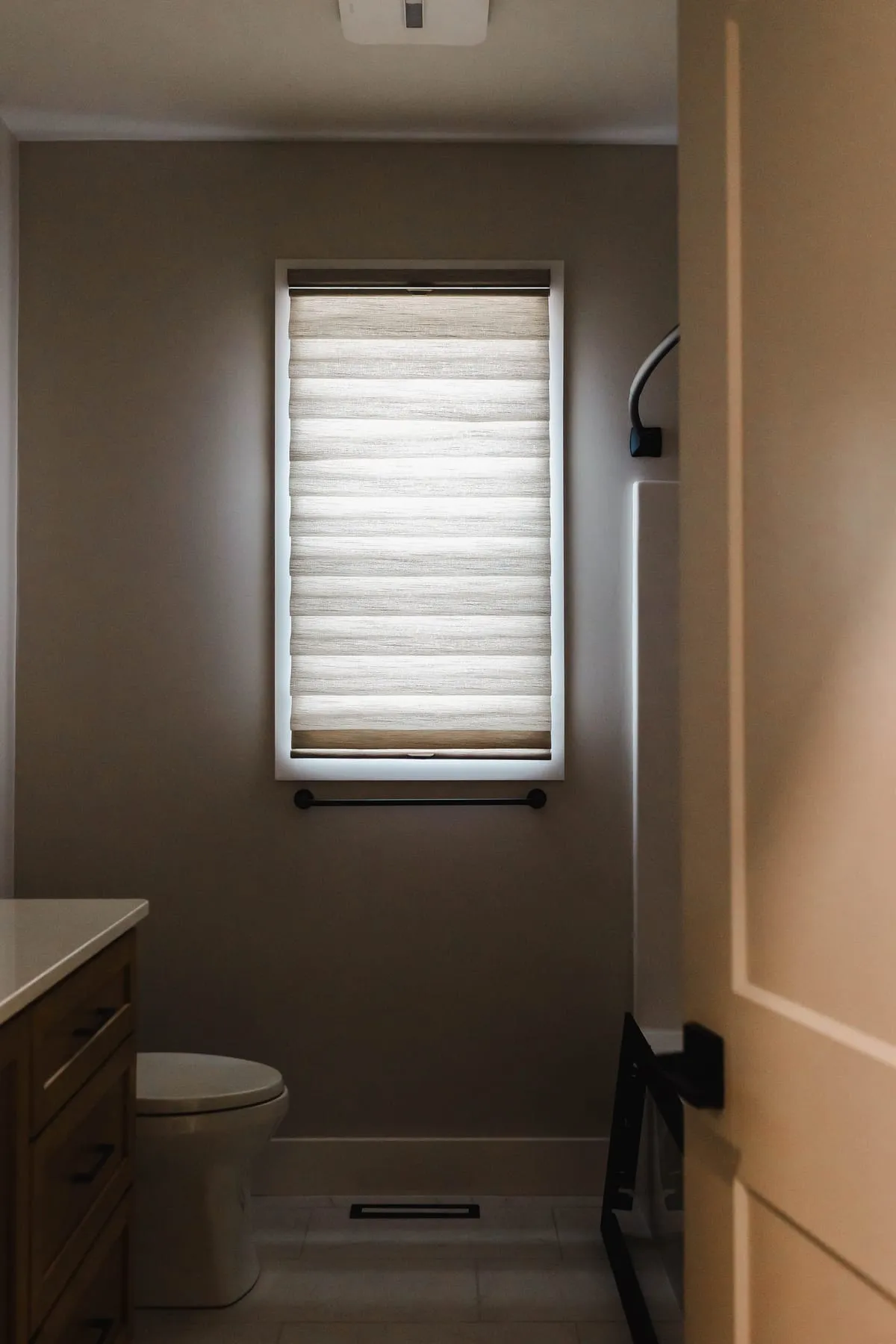 Bathroom window with a soft fabric shade