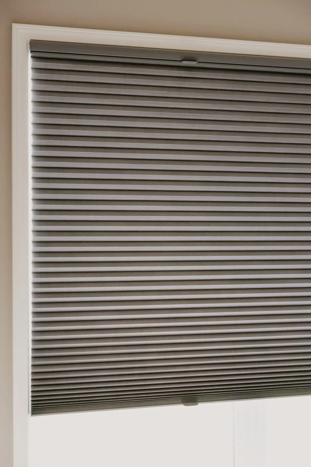 Charcoal shade lowered on a window