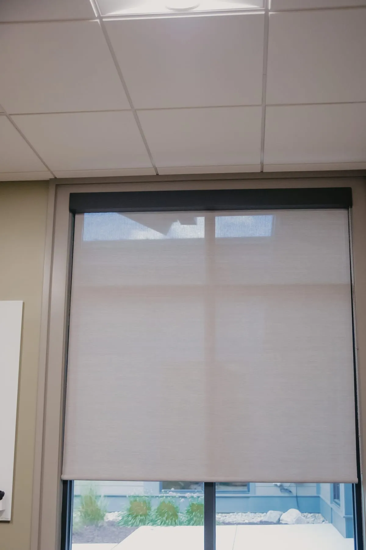 Office window with a roller shade