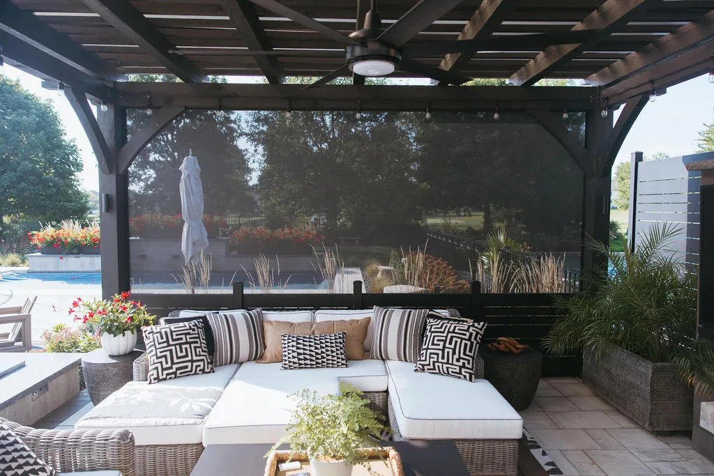 MagnaTrack screens lowered around a pergola seating area