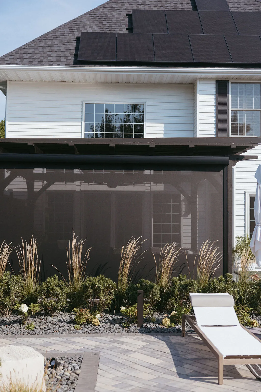 Screened pergola in front of the house