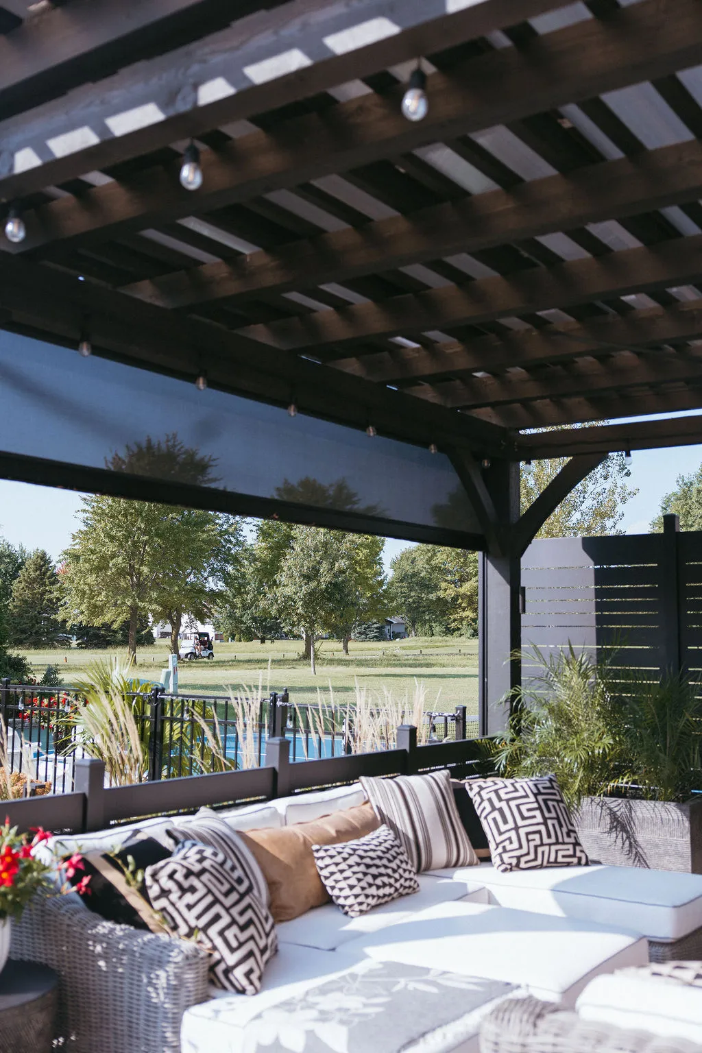 Screens raised to open the pergola to the yard