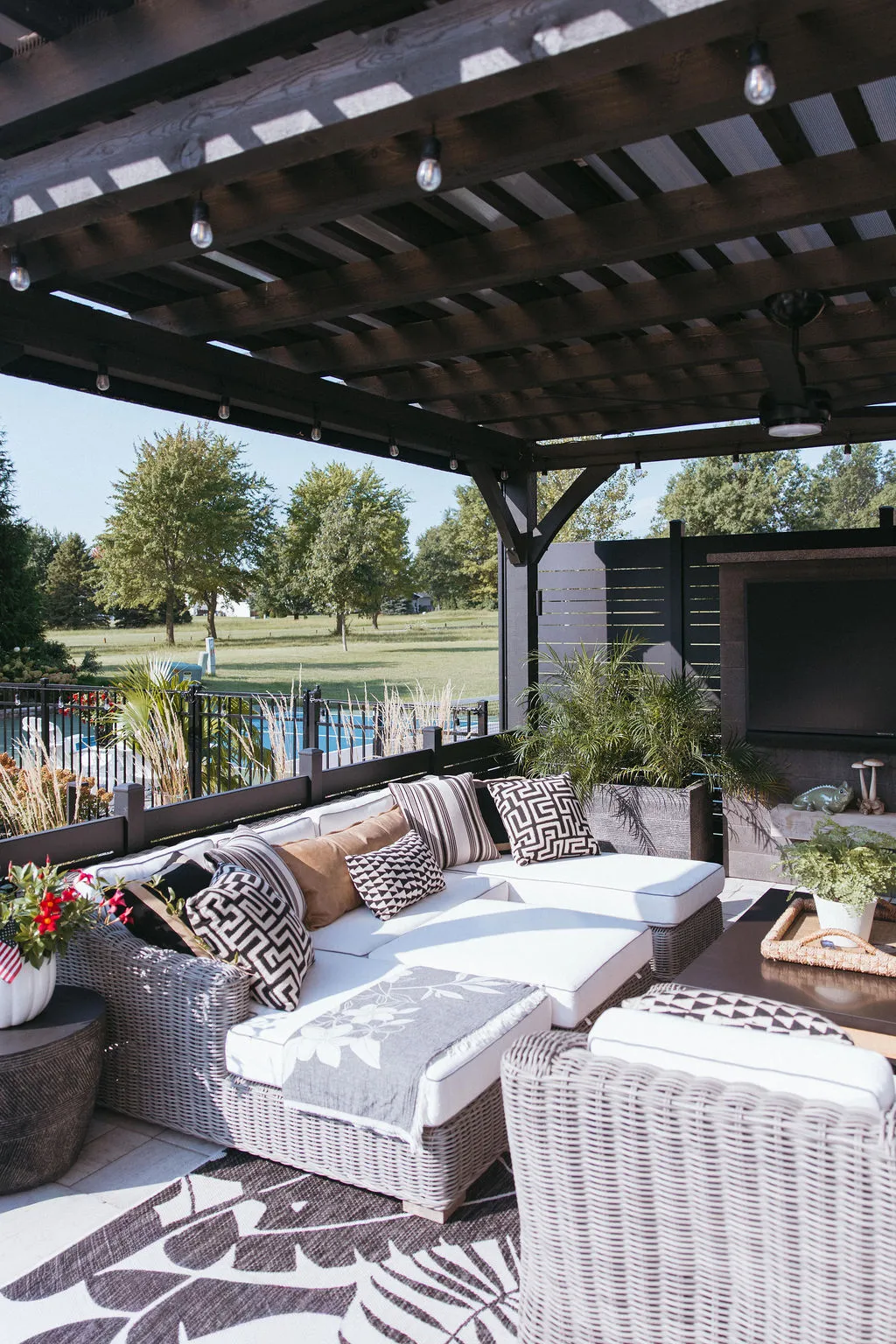 Outdoor sectional under the pergola with screens raised