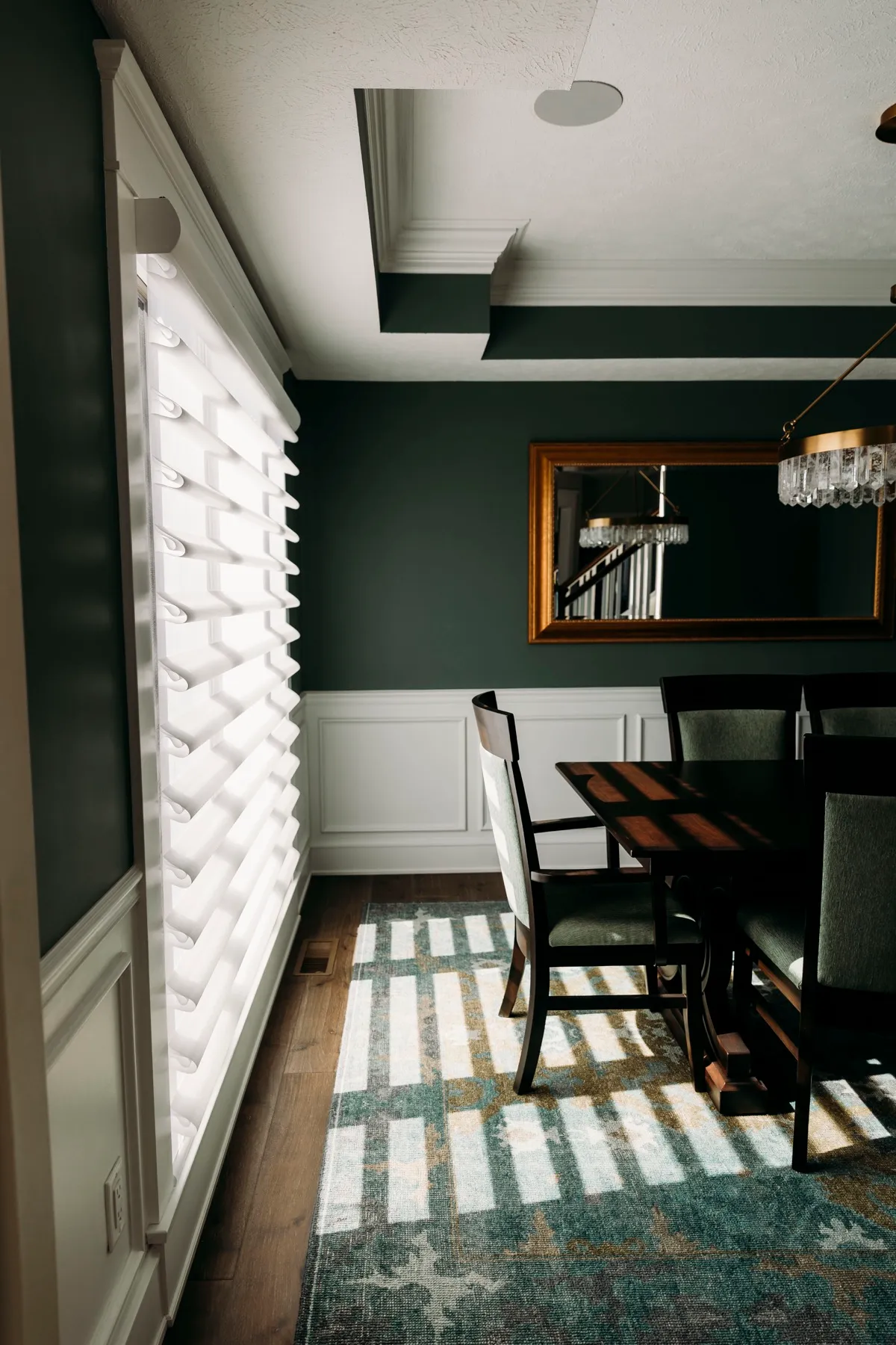 Afternoon light through sheer shadings onto the dining room floor