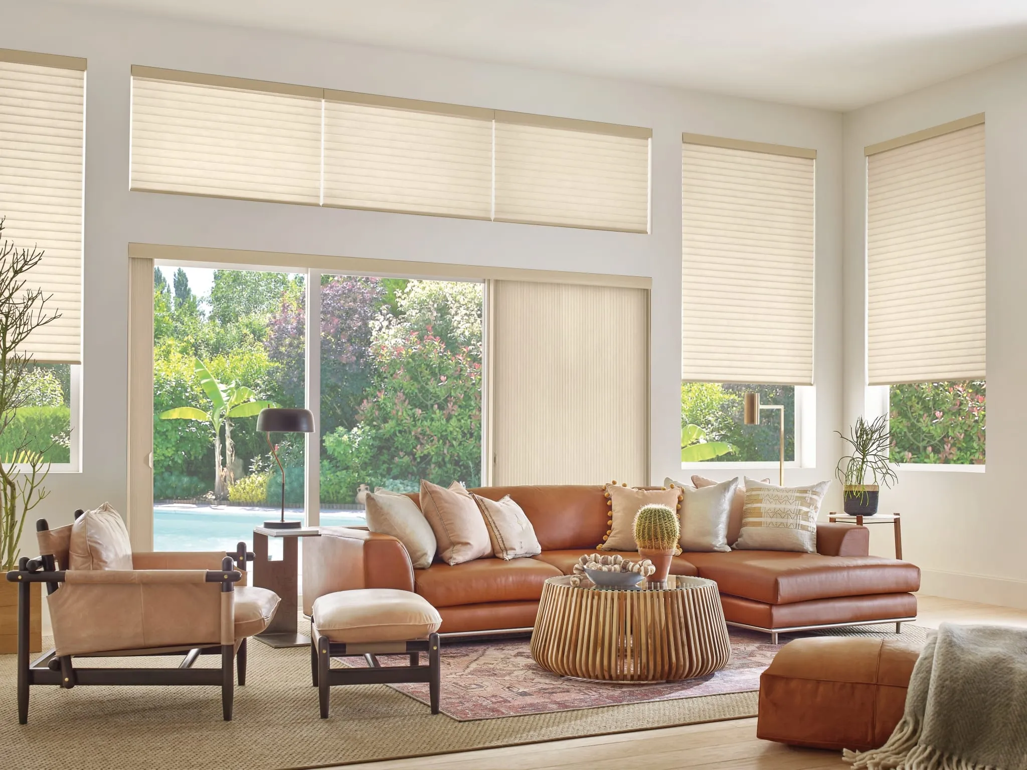 Sonnette® cellular roller shades in a living room with wide windows