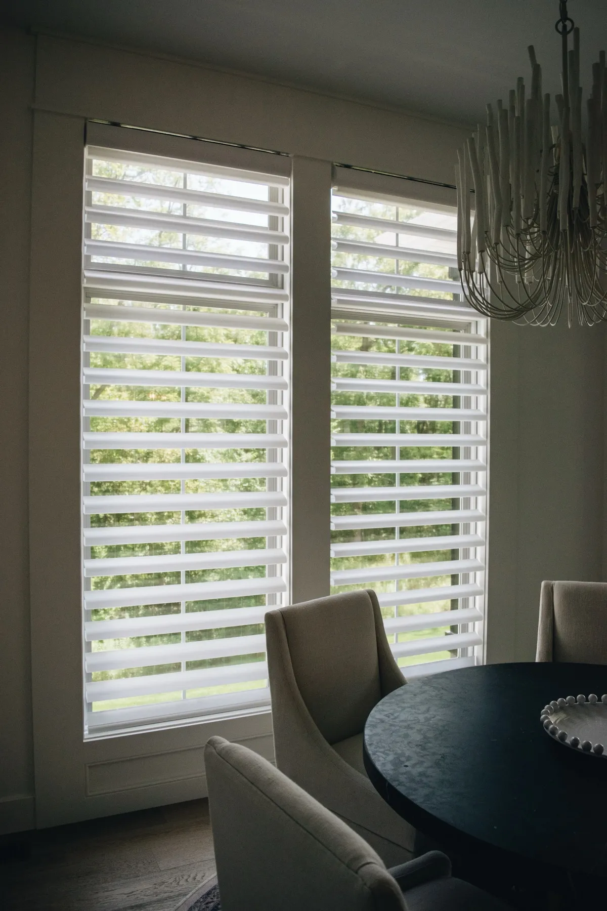 Pirouette® shades beside a round dining table