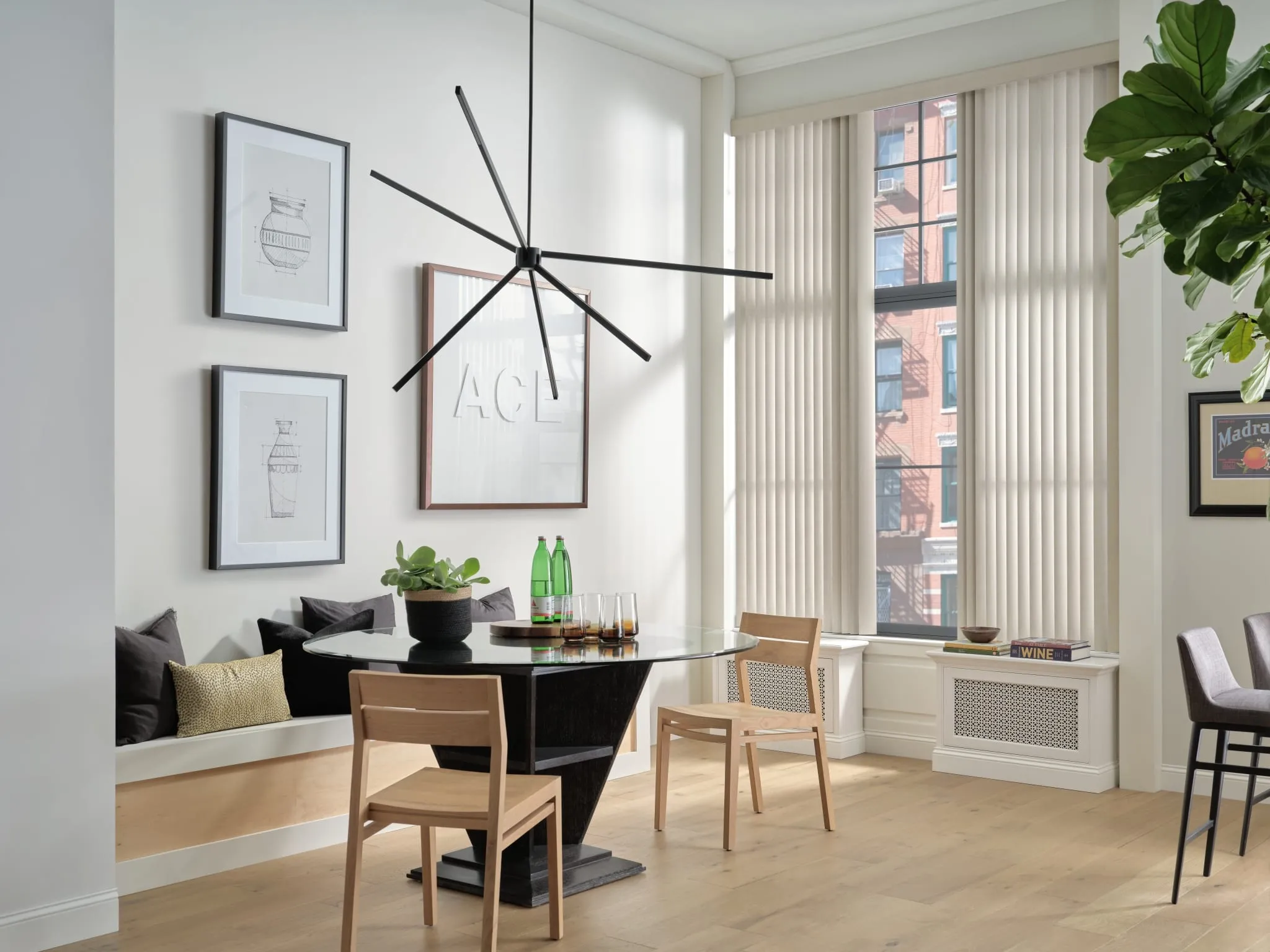 Vertical blinds on tall windows in a dining room