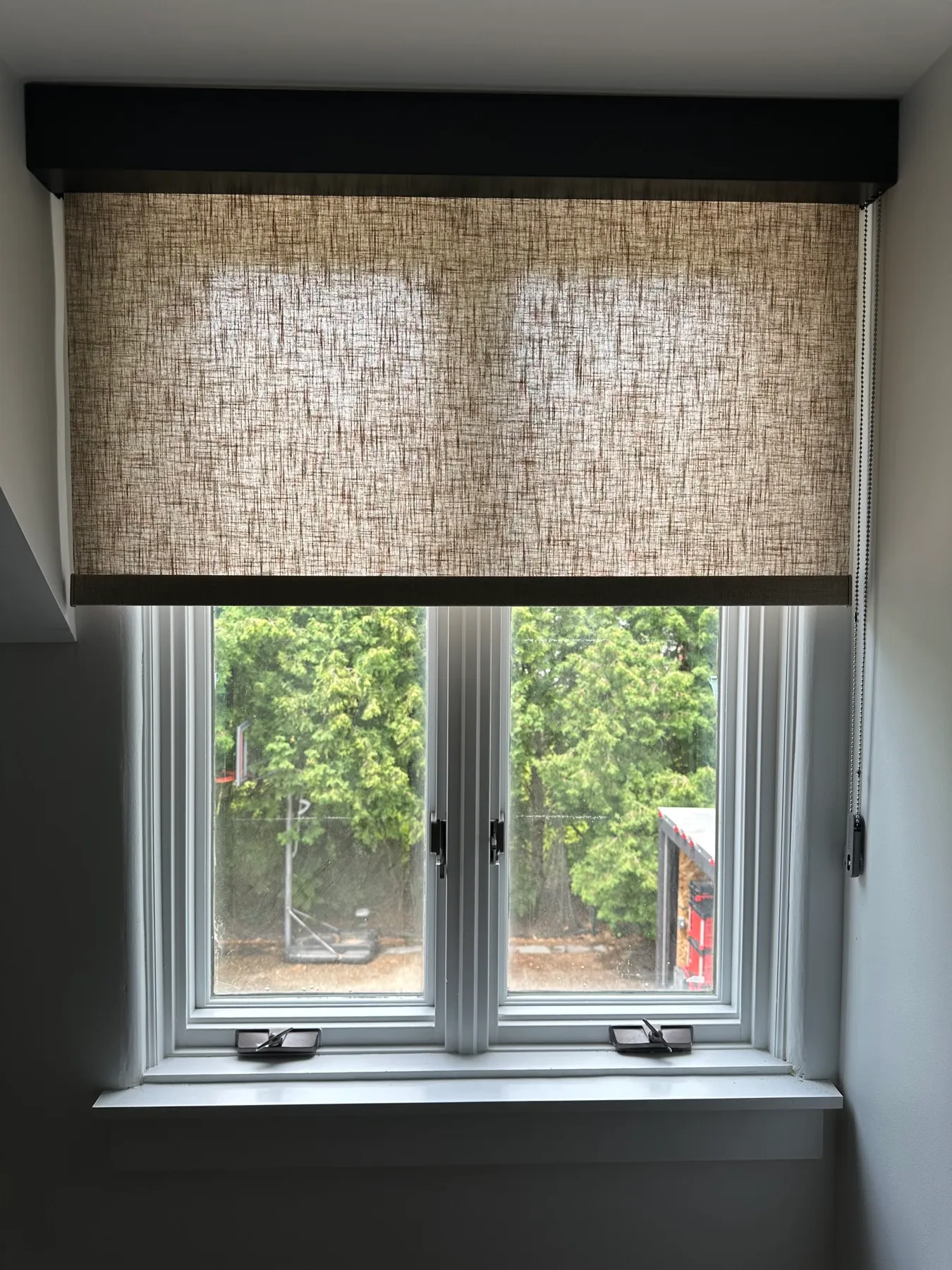 Window with a natural woven shade