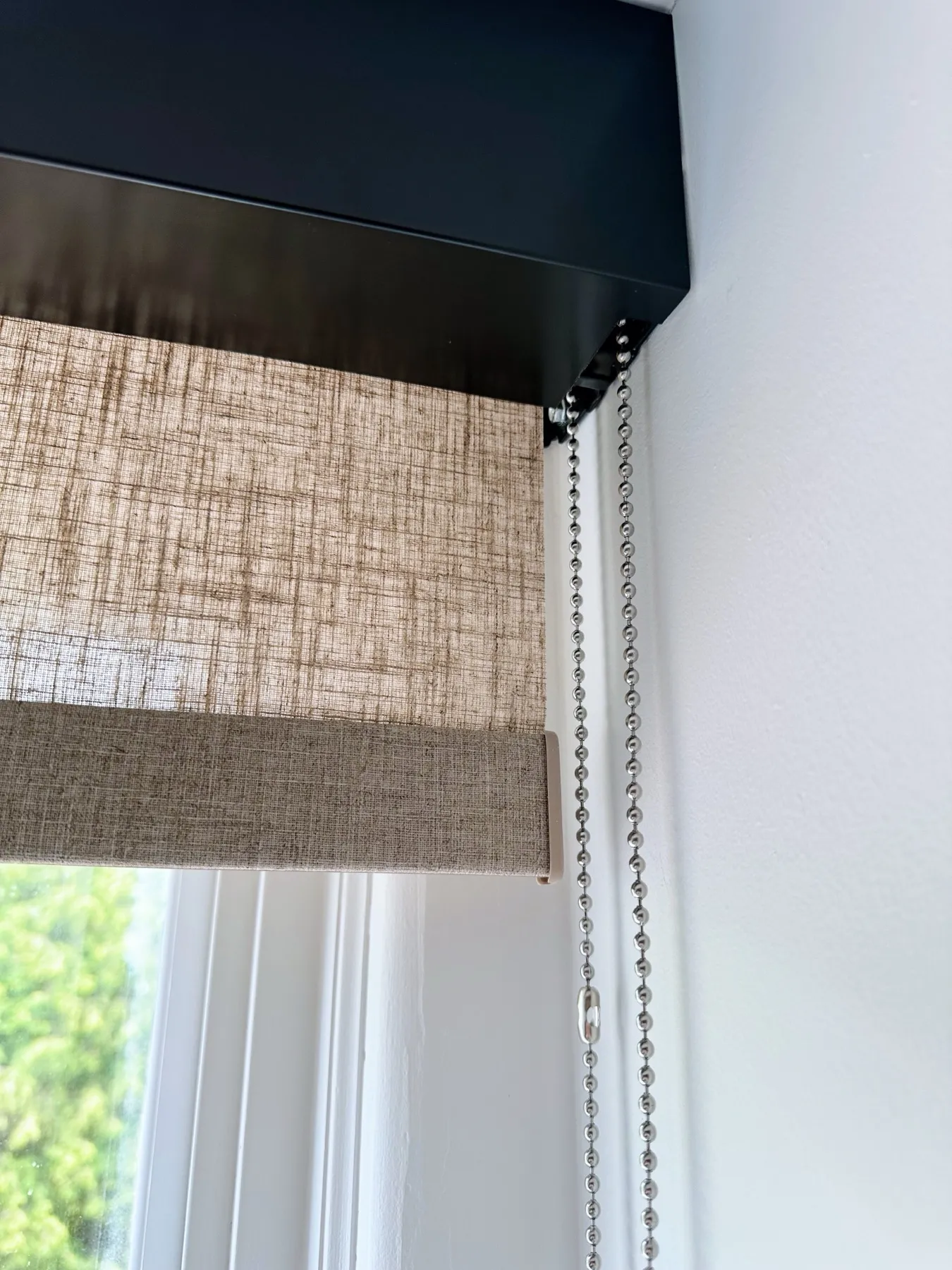 Close-up of a woven shade with a dark valance
