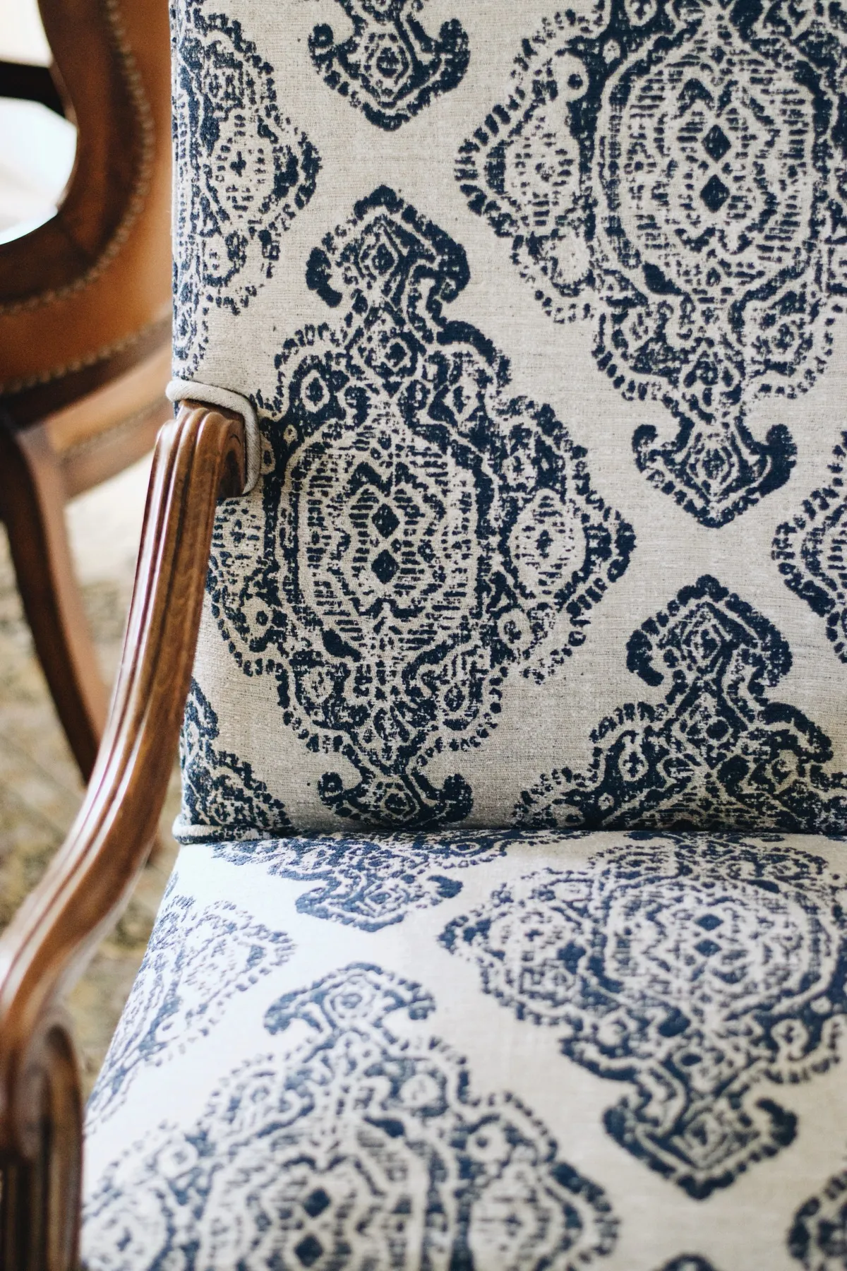 Armchair upholstered in blue-and-white patterned fabric